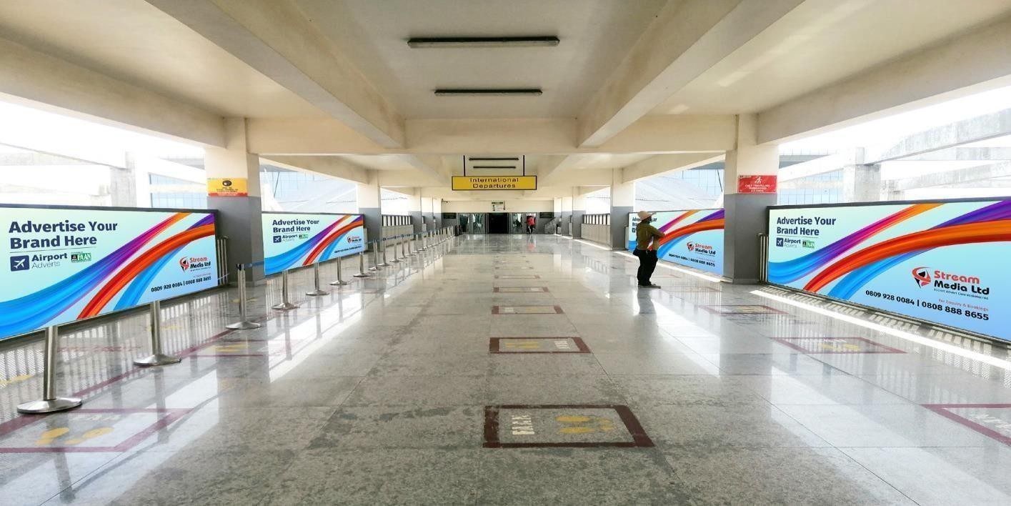 ABV-037 · Static Lightbox — Nnamdi Azikiwe International Airport, Departure Railway Concourse advertising face and surrounding environment