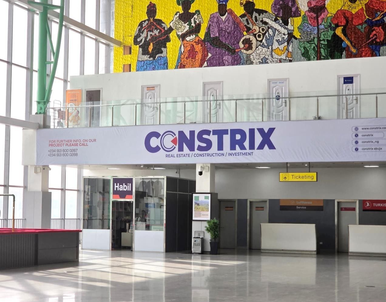 ABV-041 · Airport Lightbox — Nnamdi Azikiwe International Airport, Departure Hall Above Emirates Office advertising face and surrounding environment