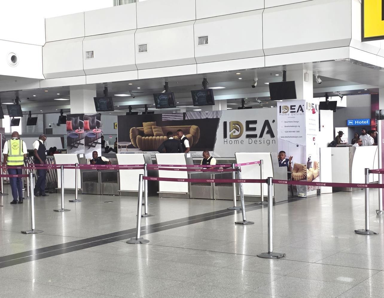 ABV-042 · Airport Lightbox — Nnamdi Azikiwe International Airport, Departure Hall Check-In Counter advertising face and surrounding environment