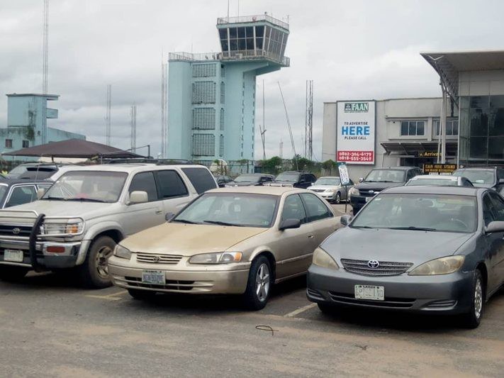 QOW-006 · Airport Billboard — Sam Mbakwe International Airport, Owerri, Arrival Exit Gate advertising face and surrounding environment