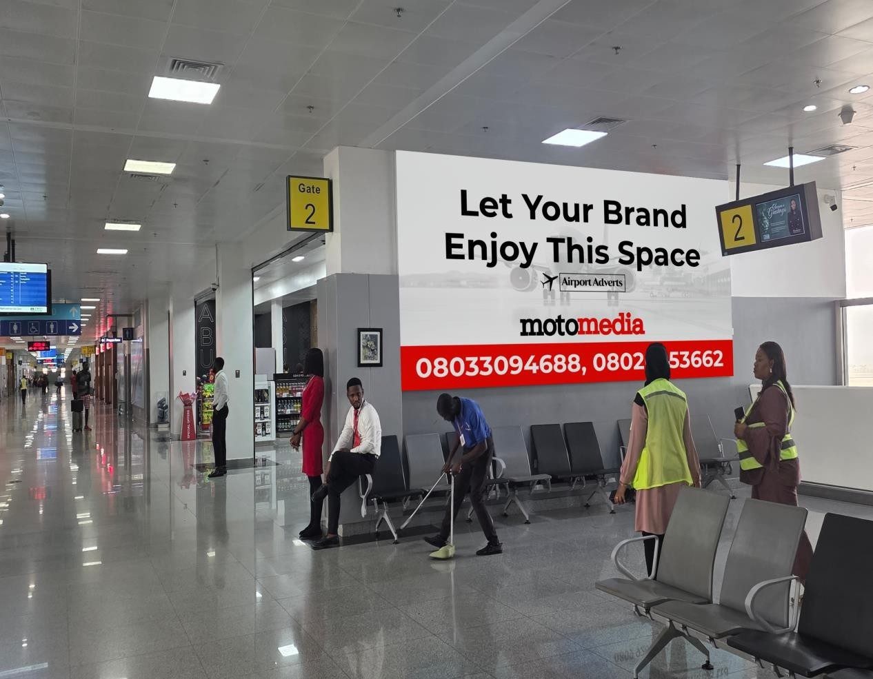ABV-053 · Static Lightbox — Nnamdi Azikiwe International Airport, Departure Gates Walkway advertising face and surrounding environment
