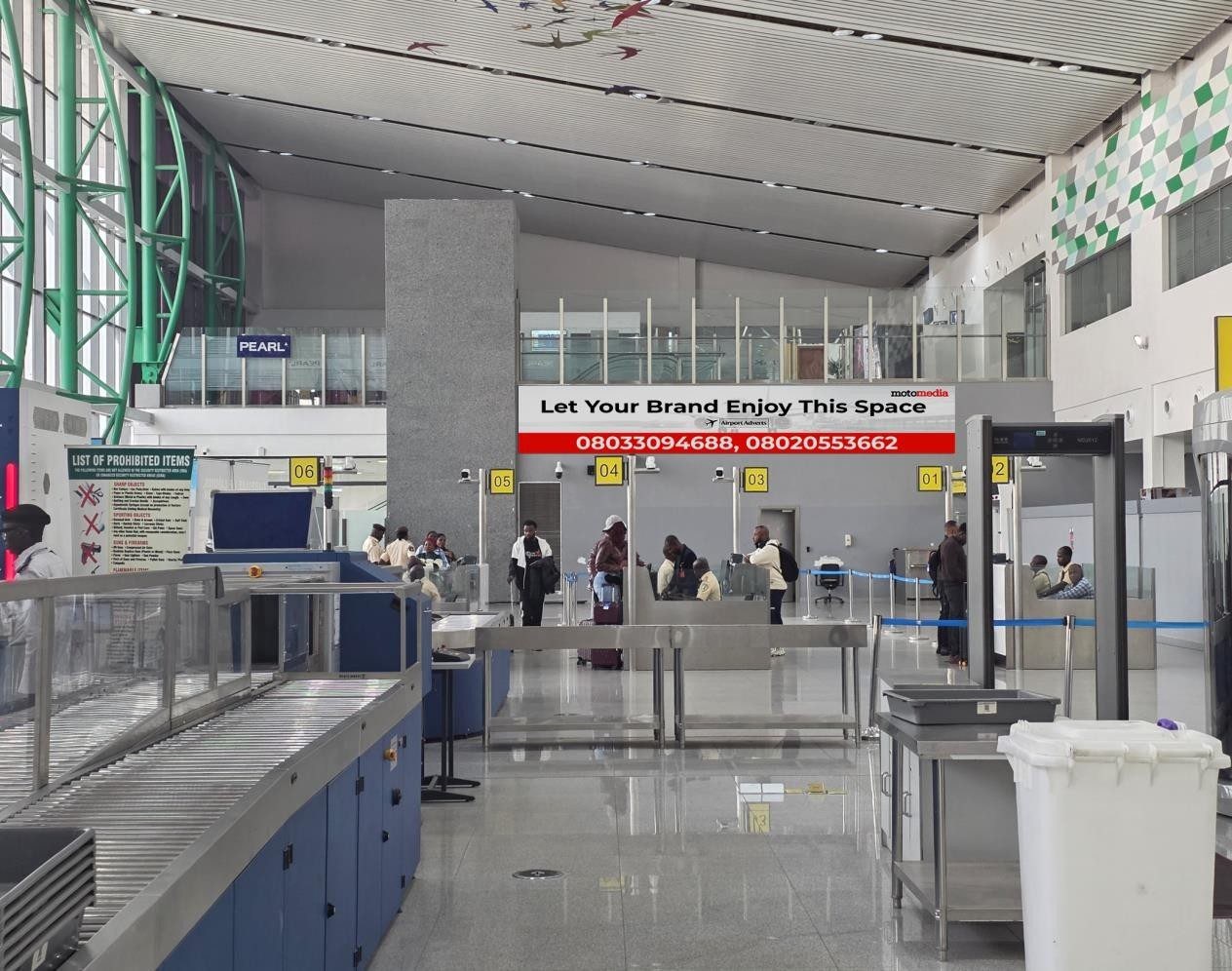 ABV-052 · Static Lightbox — Nnamdi Azikiwe International Airport, Immigration Screening Hall advertising face and surrounding environment