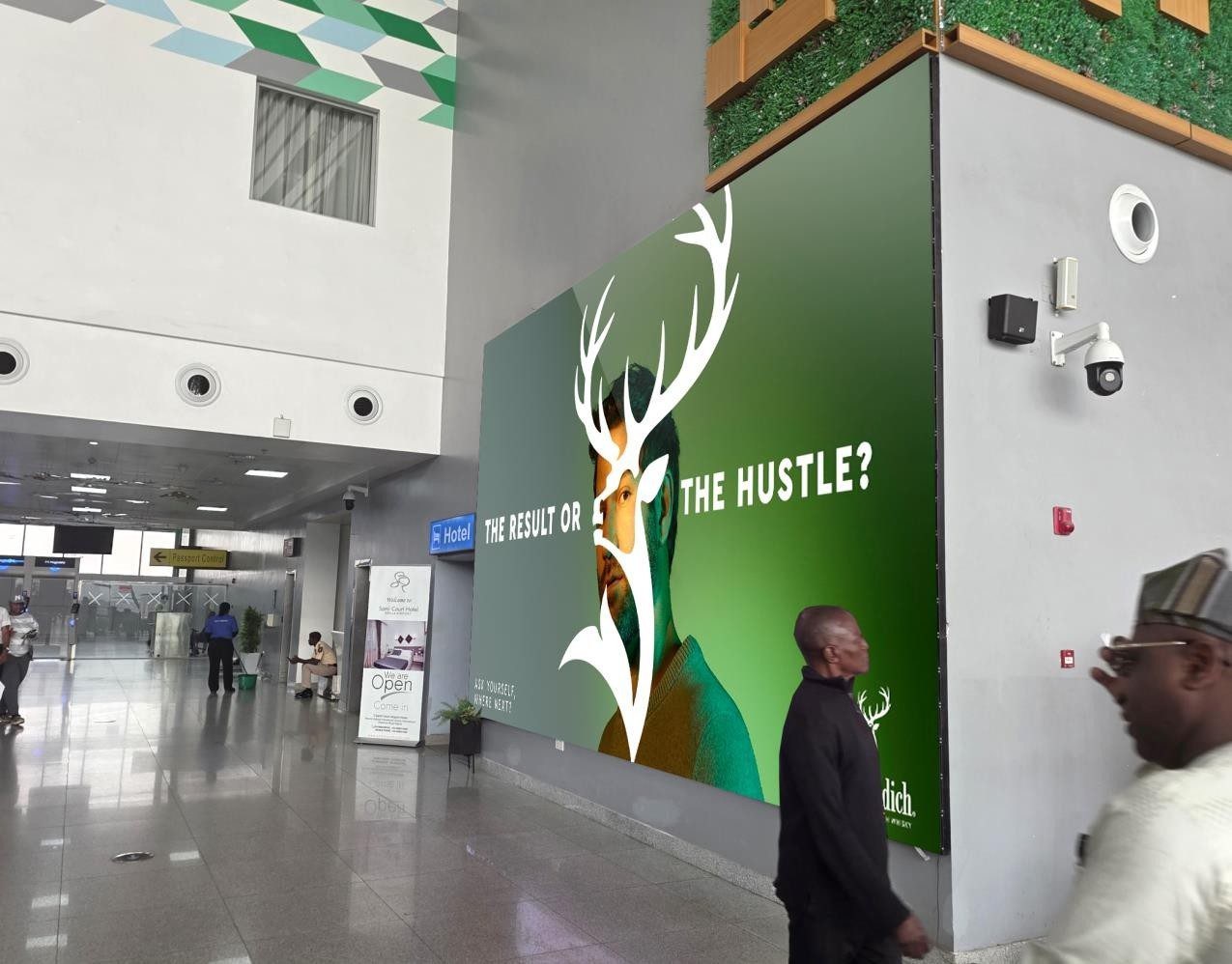 ABV-056 · Airport Digital LED — Departure Hall By Screening Gate 2, Nnamdi Azikiwe International Airport advertising face and surrounding environment