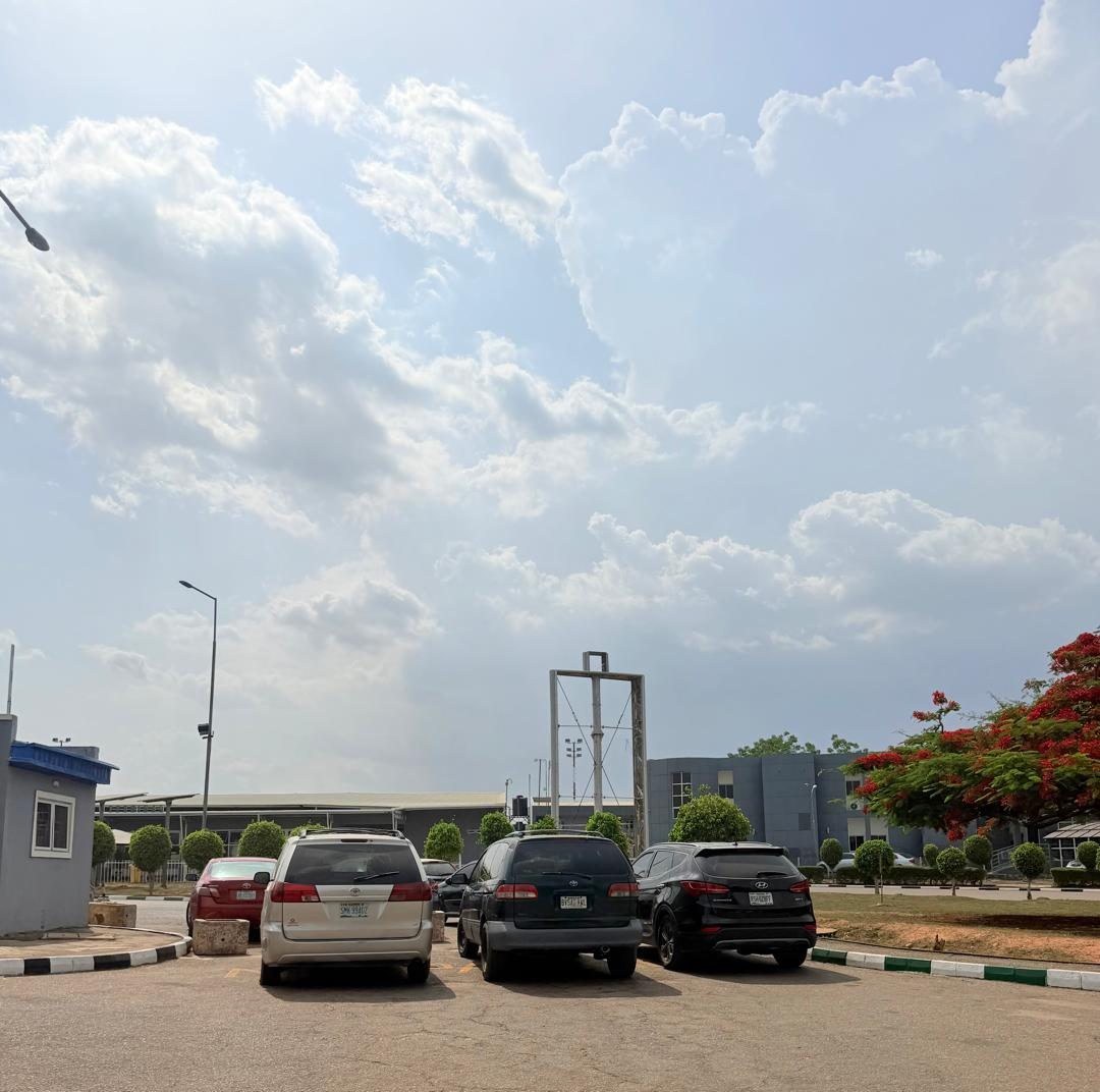 ABV-008 · Static Billboard — Nnamdi Azikiwe International Airport, Entrance to Private Wing (1) advertising face and surrounding environment