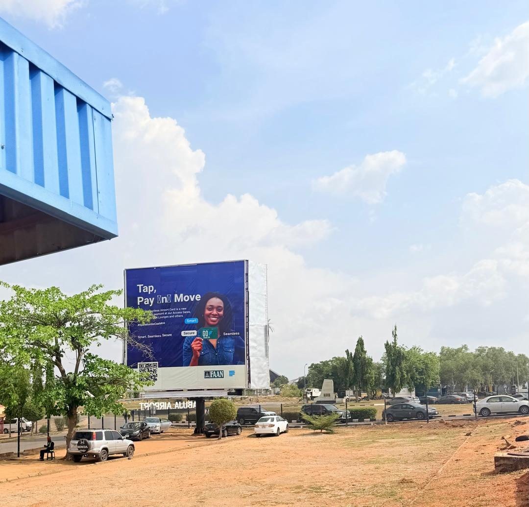 ABV-006 · Static Billboard — Nnamdi Azikiwe International Airport, Carpark Private Wing advertising face and surrounding environment