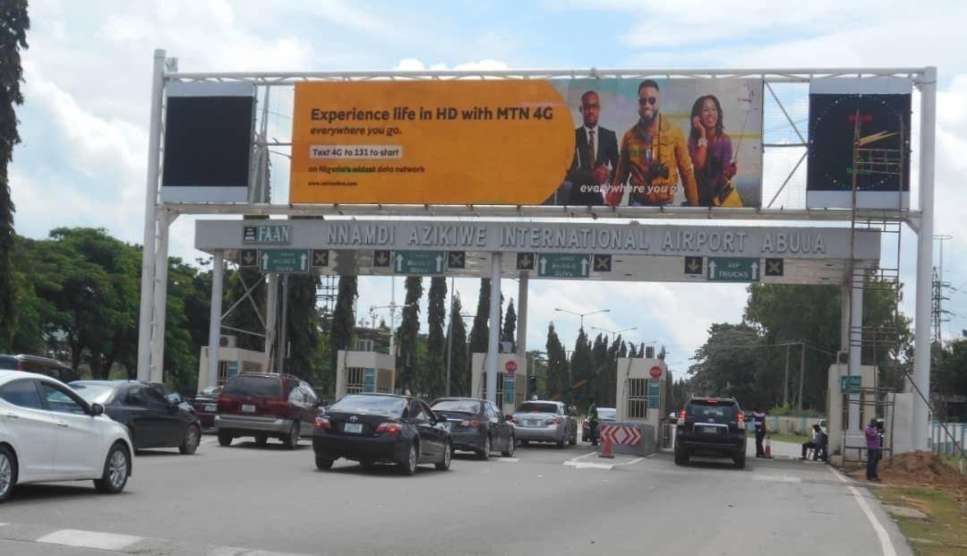 ABV-035 · Digital Billboard — Nnamdi Azikiwe Airport Tollgate, Abuja advertising face and surrounding environment