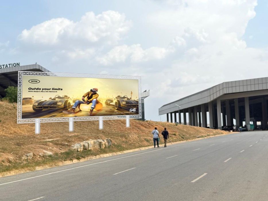 ABV-013 · Static Billboard — Airport Railway Station Hill, Nnamdi Azikiwe International Airport advertising face and surrounding environment
