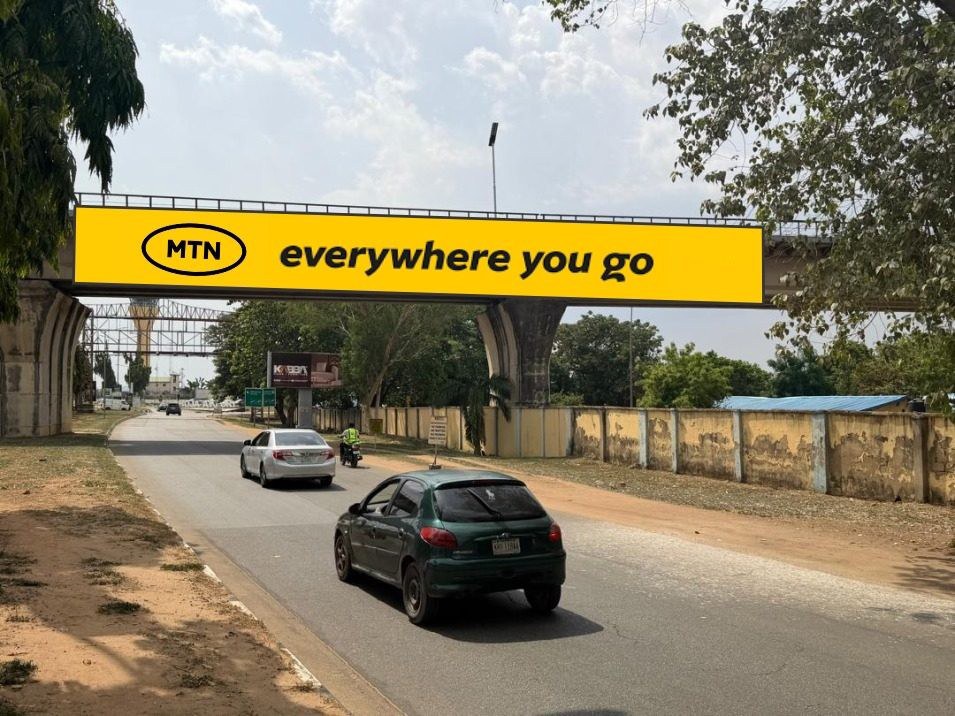 ABV-001 · Static Airport Billboard — Nnamdi Azikiwe International Airport Rail Entrance, Abuja advertising face and surrounding environment