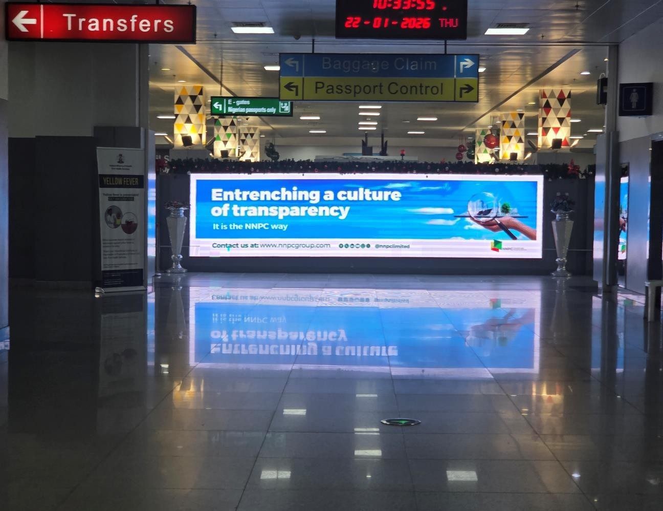 ABV-060 · Airport Digital LED — Arrival Walkway From All Gates, Nnamdi Azikiwe International Airport advertising face and surrounding environment