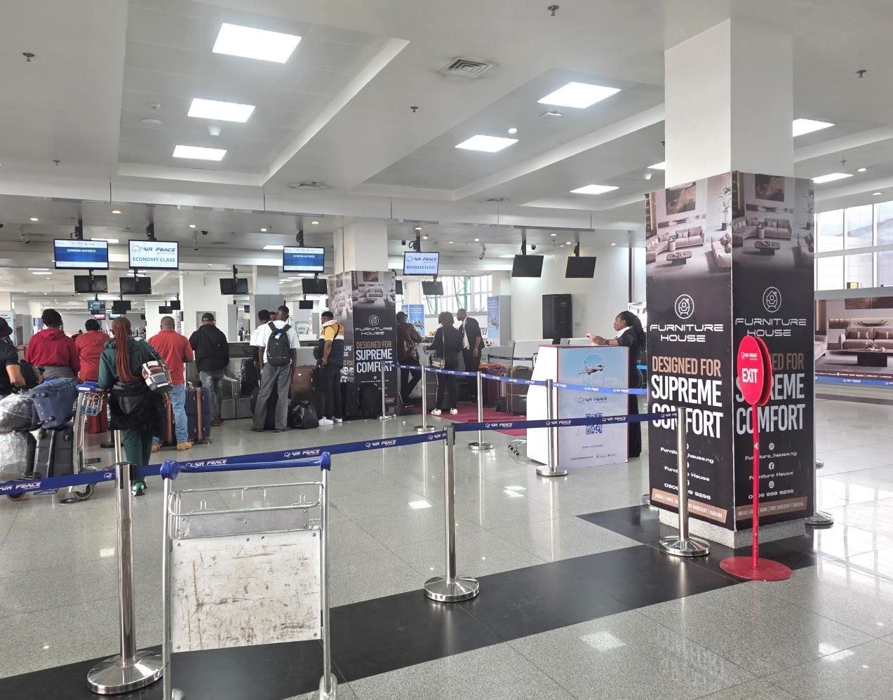 ABV-044 · Airport Pillar — Nnamdi Azikiwe International Airport, Departure Hall Check-In Pillars advertising face and surrounding environment