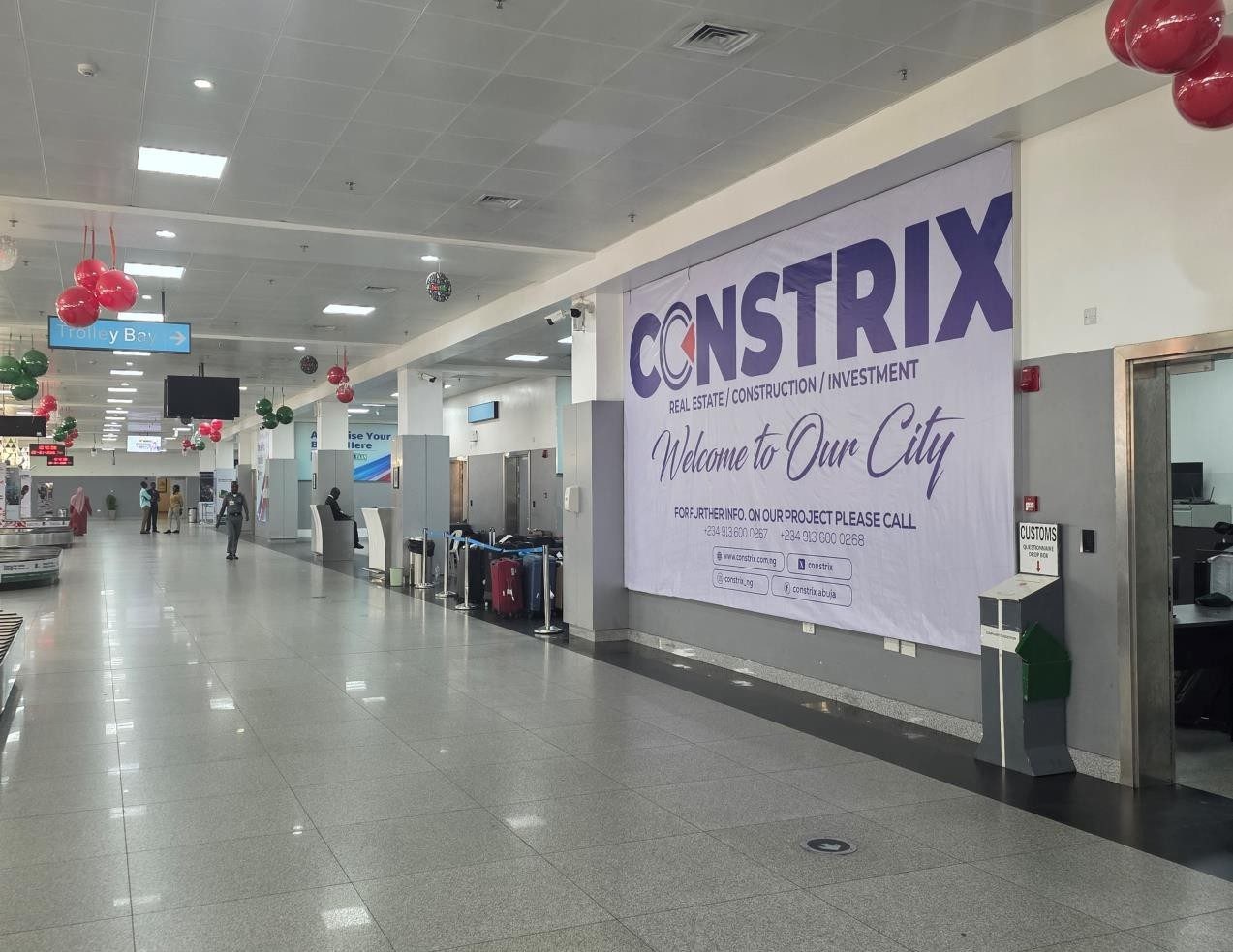ABV-066 · Airport Lightbox — Arrival Reception Hall, Abuja Airport advertising face and surrounding environment