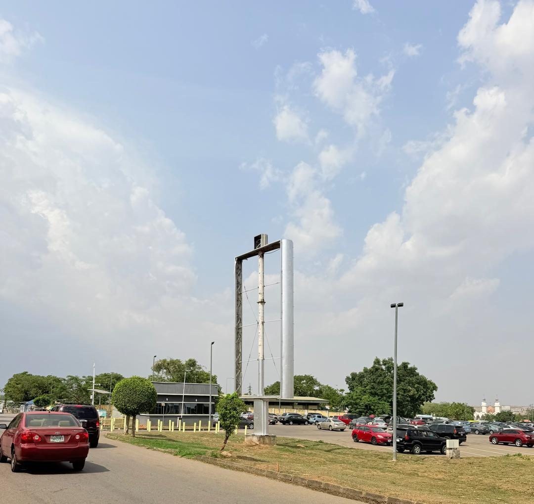 ABV-007 · Static Billboard — Nnamdi Azikiwe International Airport, General Carpark Private Wing advertising face and surrounding environment