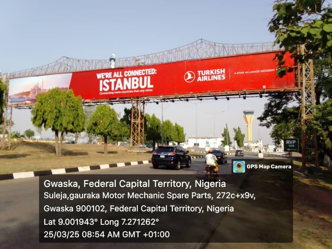 ABV-004 · Static Airport Billboard — Nnamdi Azikiwe International Airport Before Private Wing, Abuja advertising face and surrounding environment