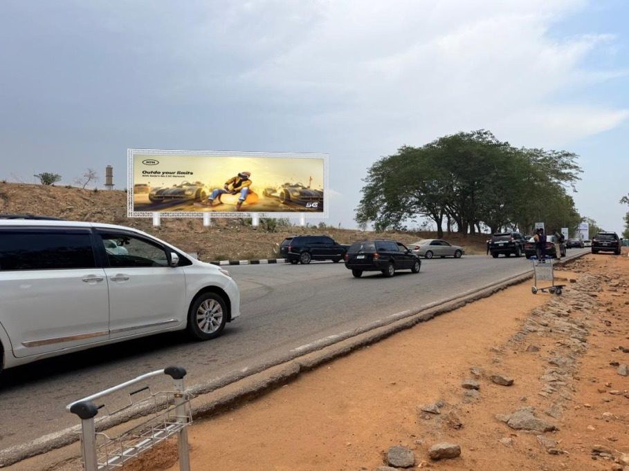 ABV-026 · Airport Static Billboard — Forecourt Exit, Abuja advertising face and surrounding environment