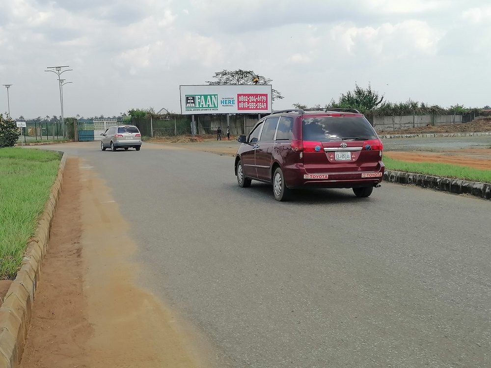 QOW-003 · Static 96-Sheet Billboard — By Tarmac Gate, Access Road advertising face and surrounding environment
