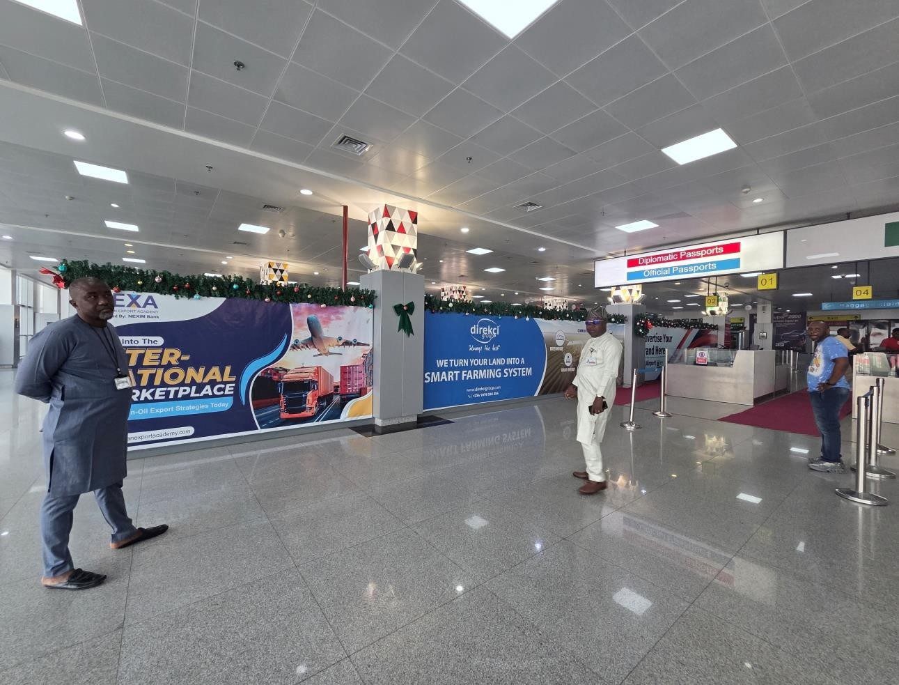 ABV-065 · Static Lightbox — Nnamdi Azikiwe International Airport, Immigration and Passport Control advertising face and surrounding environment