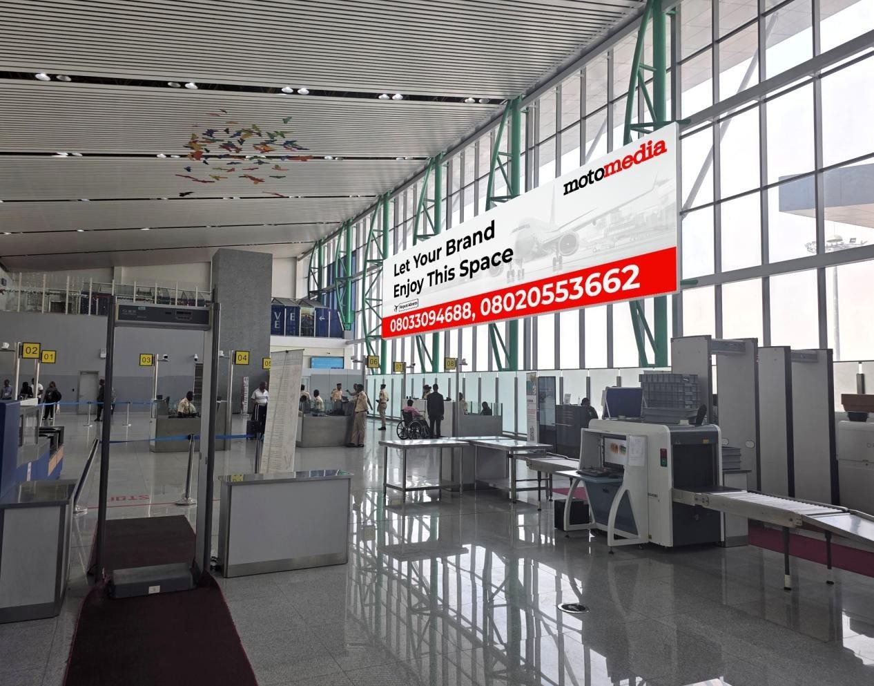 ABV-050 · Airport Wall Drape — Nnamdi Azikiwe International Airport Immigration Hall, Abuja advertising face and surrounding environment