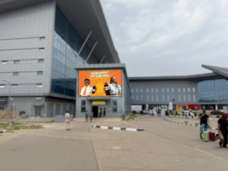 ABV-025 · Airport Billboard — Entrance Of Terminal D Domestic On Top Of International Arrivals, Abuja Airport advertising face and surrounding environment