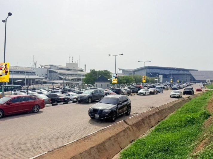 ABV-033 · Airport Lamppost — Domestic Carpark to Airport Exit, Abuja advertising face and surrounding environment