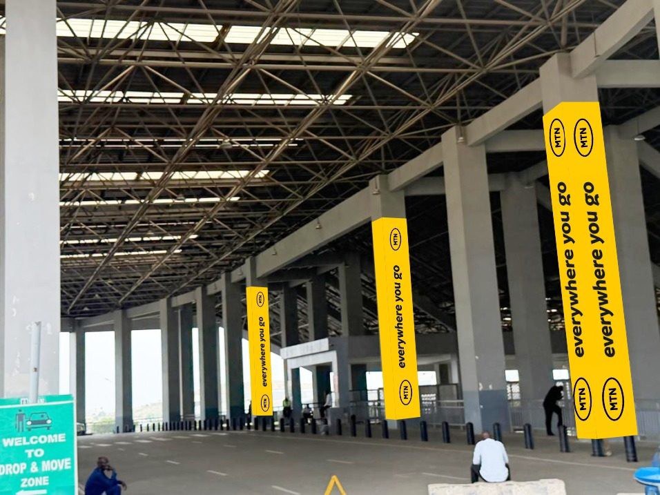 ABV-014 · Pillar Branding — International Terminal Departure & Railway Station, Nnamdi Azikiwe International Airport advertising face and surrounding environment