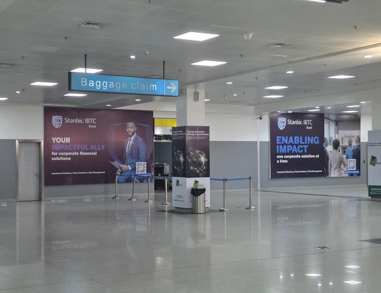 ABV-061 · Static Lightbox — Nnamdi Azikiwe International Airport, Arrival Baggage Claim Hall advertising face and surrounding environment
