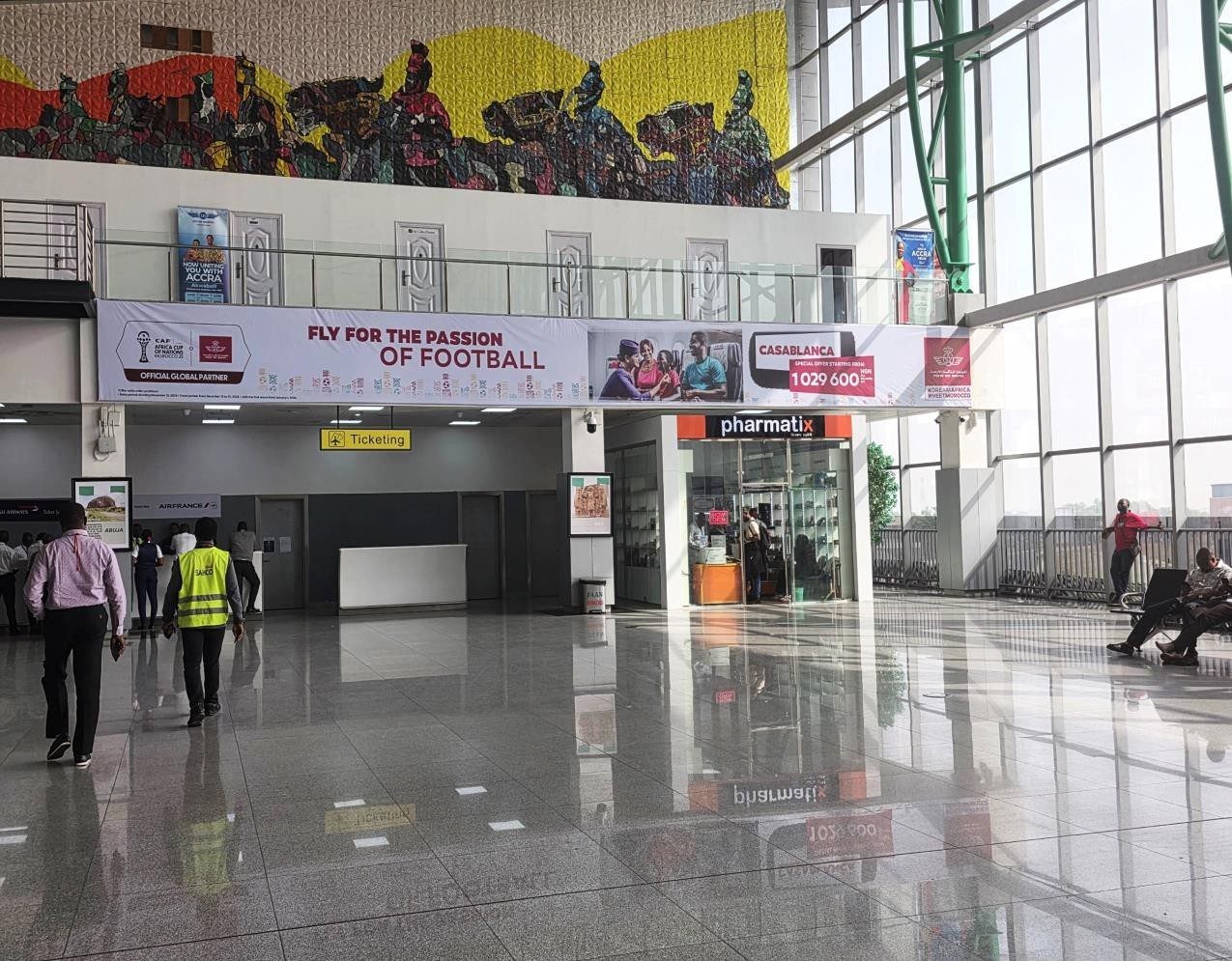 ABV-040 · Static Lightbox — Nnamdi Azikiwe International Airport, Departure Hall Above Emirates Office advertising face and surrounding environment