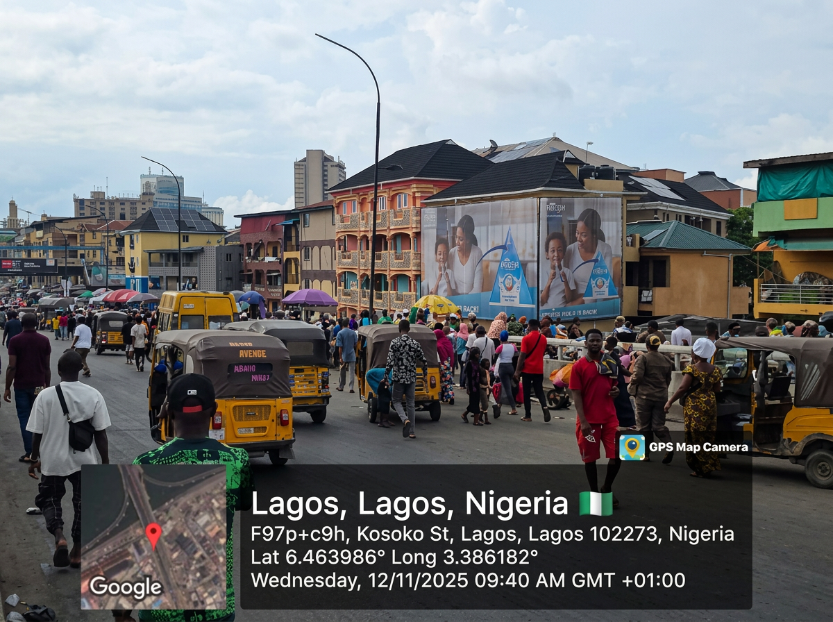 Market wall drape – New Marina Road by Idumota Market advertising face and surrounding environment