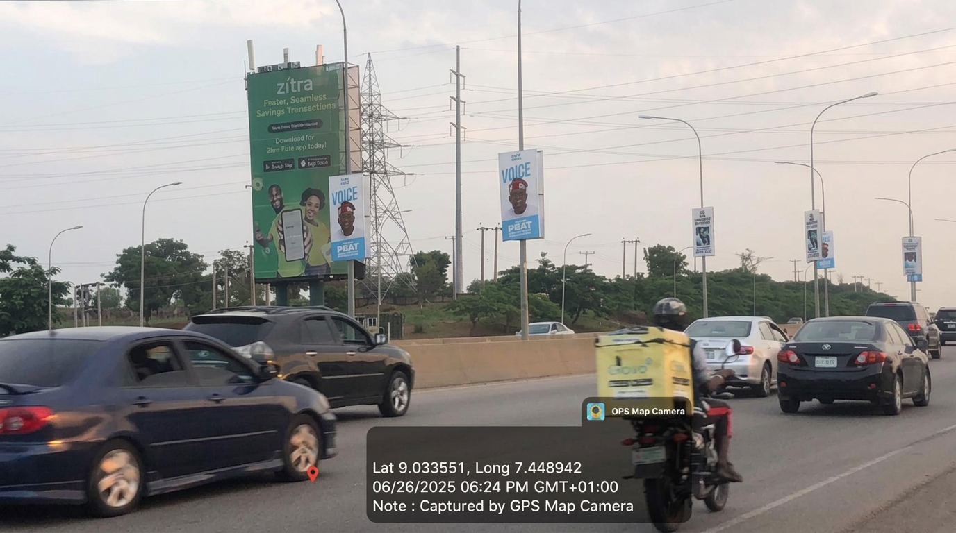 Airport Road static portrait – by Oladipo Diya intersection advertising face and surrounding environment