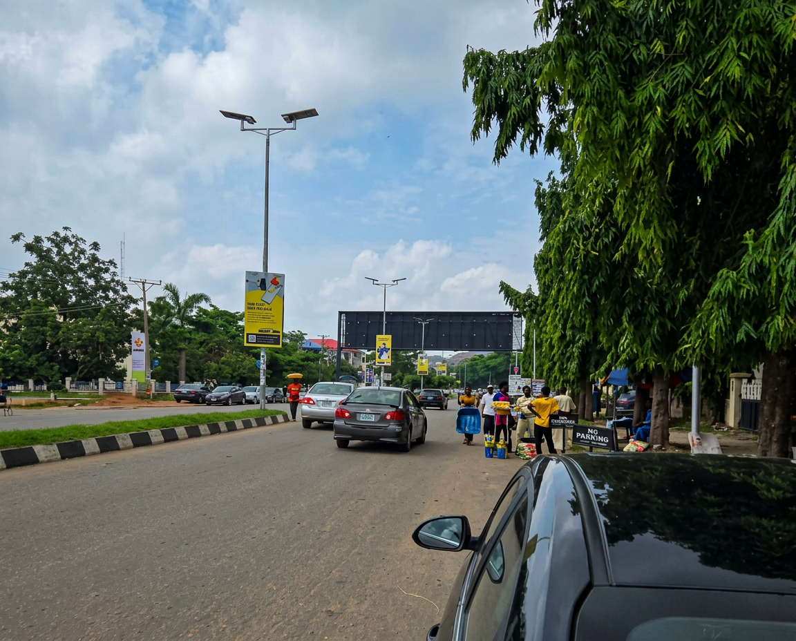 Gantry – Ladoke Akintola Blvd by Access Bank FTF Garki Market advertising face and surrounding environment